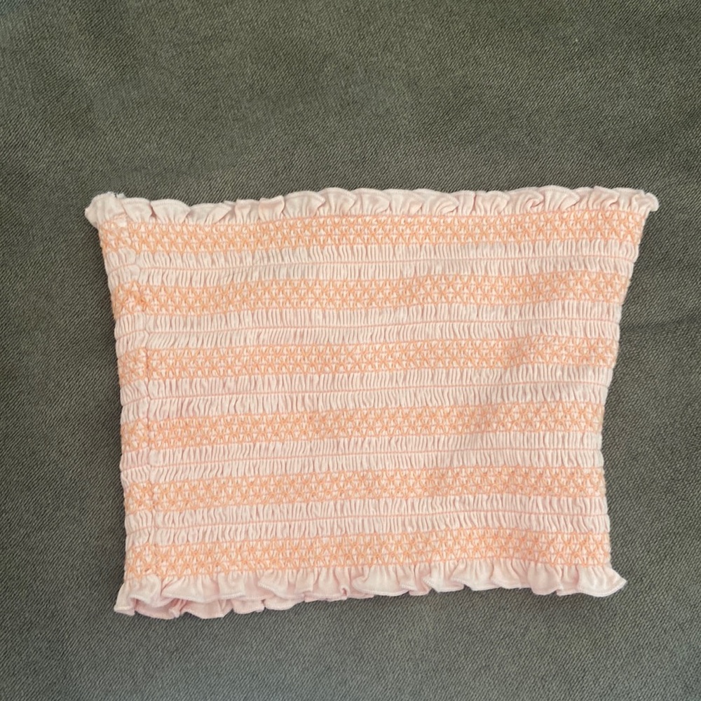 Pink and peach tube top for teens and young adults.